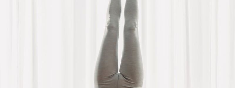 Blurred motion of a person practicing yoga.